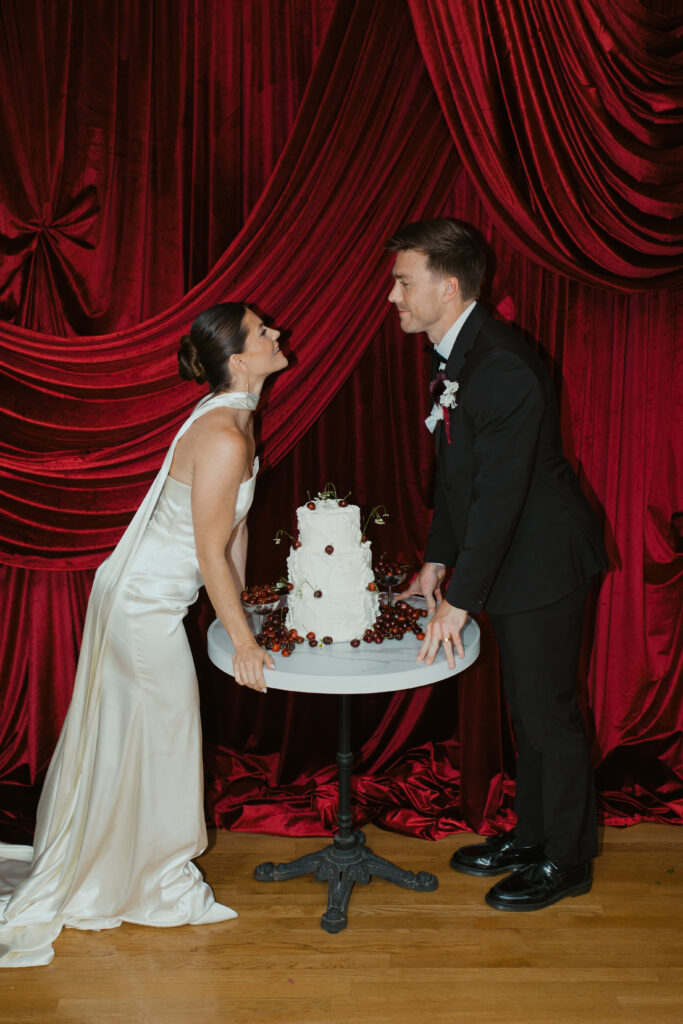 Vintage cake with cherries styled for bold red wedding inspiration